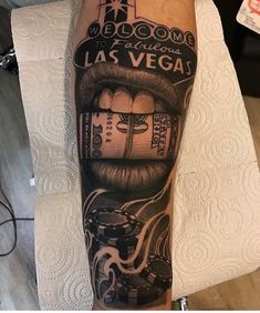 a man's leg with a tattoo on it that says welcome to las vegas