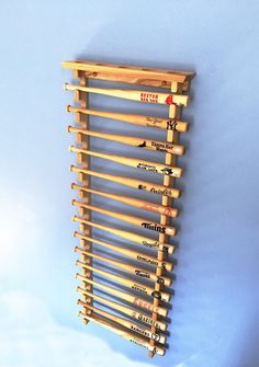 a wooden rack holding several pairs of skis on it's sides and the bottom