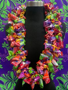 a necklace made out of candy bars on a mannequin