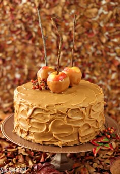 a cake sitting on top of a plate covered in frosting and fruit toppings