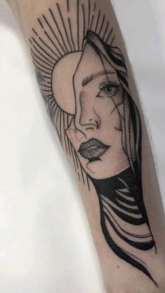 a woman's face and sun tattoo on the arm