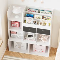 a white book shelf filled with lots of books