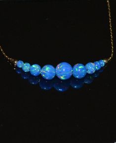 This is a very beautiful and delicate 14k Gold Filled necklace with dark blue opal beads bar. This is a very versatile item that adds a bit of style to any outfit. M a t e r i a l s Your necklace can be made of the following materials: Sterling Silver or 14k Gold Filled. Please select material during checkout process. M e a s u r e m e n t s - Available necklace lengths: 15, 16, 17, 18, 19, 20 inches - The length of the entire necklace is measured from end to end - Model on the pics wears 17 inc Cheap Fun Blue Necklaces, Cheap Blue Alloy Necklace, Affordable Blue Hypoallergenic Necklaces, Peacock Blue Opal Jewelry, Affordable Blue Everyday Necklace, Chic Cheap Blue Necklaces, Opal Jewelry Necklaces, Cheap Blue Everyday Necklace, Blue Opal Beaded Necklace