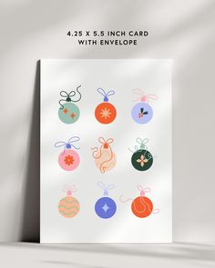 a card with christmas ornaments on it and the words, 42 x 5 inch each card with envelope