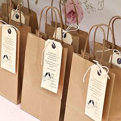 small brown paper bags with tags on them