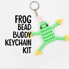 the frog bead buddy keychain kit is green and has yellow beads on it