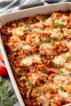 a casserole dish filled with meat and cheese