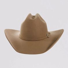 Introducing the Cattleman Womens Felt Cowboy Hat, a true iconic Cattleman-shaped crown with a shovel brim for that Yellowstone Dutton Ranch Hat look. Offered by American Hat Makers means that you can rest easy because it is backed by our 50 years of experience and Lifetime Guarantee. Featuring a sewn-in sweatband with a unique hidden pull strap tightening system for a one of a kind fit! Plus we’ll include two adhesive size reducers for an even more custom experience. Brim 4" Crown 4 3/4" Midweight Felt Wool | Matching Felt Band with Buckle Easily adjusts to your head size with hidden sewn-in pull straps Package includes two (free) adhesive size reducers to make a perfect fit Color: Sand Felt Cowboy Hats Women, Ranch Hat, Cowboy Hats Women, Yellowstone Dutton Ranch, Felt Cowboy Hat, American Hat Makers, American Hat, Dutton Ranch, Felt Cowboy Hats