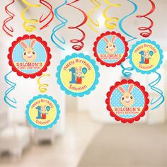 some balloons and streamers with buntings on them for a 1st birthday party