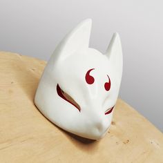 Awesome Japanese Kitsune Fox Demon Mask will complement your cosplay costume or party look! Bright colors, easy to wear, super lightweight! Features: - Super Lightweight and Extra Durable (casted of Polyurethane plastic) - ALREADY FINISHED (sanded) AND PAINTED - Attachment included Size: - length 7.5" (19 cm) - width 6.1" (15.5 cm) - height 4.4" (11.5 cm)  Fits a regular human head You will receive: - Mask (finished, painted, varnished) - Adjustable black rubberband fastening (easy to assemble) White Cosplay Costume Mask, White Mask For Cosplay, White Mask Costume Accessories For Cosplay, Fox Demon, Japanese Fox Mask, Japanese Kitsune, Cosplay Horns, Demon Mask, Claw Gloves