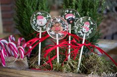 christmas lollipops with santa and snowmen on them