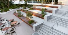 an outdoor seating area with tables and chairs