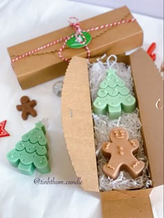 an open box filled with cookies and decorations