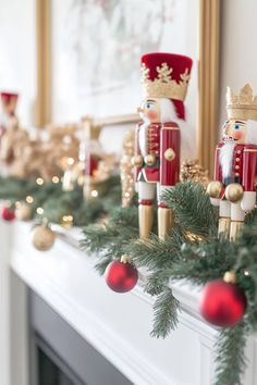 a mantel decorated with christmas decorations and nutcrackers