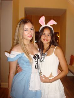 two girls in bunny ears are posing for the camera