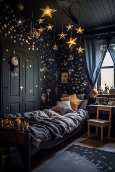 a child's bedroom with stars hanging from the ceiling, and a bed in front of a window