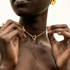 The Amali Lariat Necklace introduces a new curved quill silhouette for SOKO. This piece makes an impactful addition to your layers or makes for a beautiful, unique solo statement piece. In Swahili, Amali means hope. Handcrafted by artisans in Kenya with 24k gold plated brass using traditional casting techniques. Length: 20.07in (510mm)Brass Tube; 0.23in x 0.11in (6mm x 3mm)Toggle Dimension: 0.78in (20mm)Pendant Dimension: 2.36in x 0.15in (60mm x 4mm) Luxury Long Drop Brass Jewelry, Dope Jewelry Accessories, Gold Lariat Necklace, Modern Gold Jewelry, Toggle Necklace, Dope Jewelry, Lariat Necklace, Online Accessories, Statement Jewelry