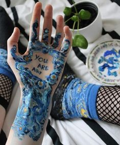 someone has their hand painted with the words you are