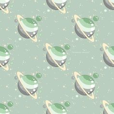 an image of a green and white pattern with stars on the background that looks like saturn