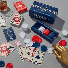 playing cards, dices and cups on a table