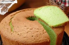 a green cake with a slice cut out of it