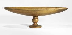 an old brass bowl on a white background