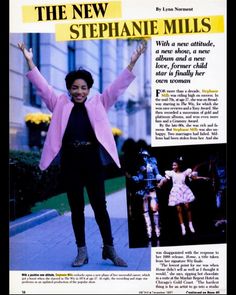 the new stephanie mills article features an image of a woman with her arms in the air