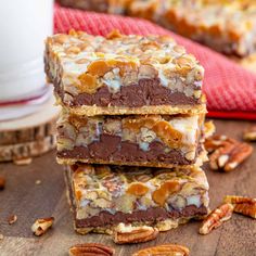 three pieces of pecan bar stacked on top of each other