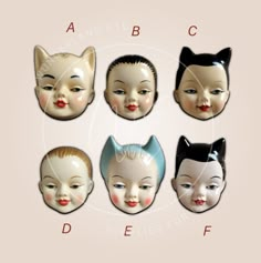 an assortment of doll heads with different facial shapes and hair colors, including black cat ears