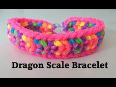 a pink bracelet with multicolored beads on the end and a white background that says dragon scale bracelet