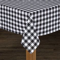 a black and white checkered tablecloth on a wooden table