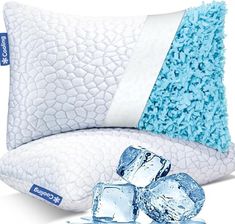 a pillow with ice cubes on it next to an ice - filled pillow that is white and blue