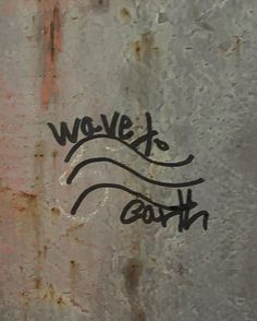 graffiti on the side of a building that says wovelx south in black ink