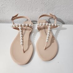 Stuart Weitzman Goldie Pearl Nude Embossed Stud Jelly Thong Sandals Women Size 5 Nwob Sandals Have Small Imperfections. See Pictures For The Best Description. *Disclaimer* An Item That Is Sent Back Must Be Returned In The Original Condition In Which Is Received To Be Eligible For A Full Refund. Elegant T-strap Sandals With Flat Heel For Vacation, Elegant T-strap Sandals For Vacation, Elegant T-strap Sandals With Single Toe Strap For Vacation, Elegant T-strap Toe Post Sandals For Vacation, Elegant T-strap Sandals With Ankle Strap For Vacation, Elegant Flat Jelly Sandals, Elegant T-strap Toe Post Sandals For Summer, Elegant Single Toe Strap Flip Flops For Vacation, Elegant T-strap Sandals With Toe Post For Spring