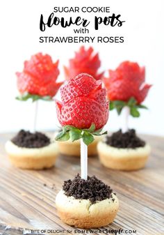 small cookies with strawberries on top and chocolate chips in the middle, sitting on a wooden table