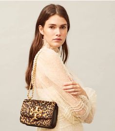 Introducing Tory Burch Eleanor. From the runways of 2020, the Tory Burch Eleanor Bag Collection was debuted. Included in the new Tory Burch Eleanor Collection: Tory Burch Eleanor Shoulder Bag; Tory Burch Eleanor Quilted Bag; Tory Burch Eleanor Leopard Bag; Tory Burch Eleanor Clutch; Tory Burch Eleanor Wallet; Tory Burch Eleanor Mini Crossbody;  Tory Burch Eleanor Belt; and the Tory Burch Eleanor Phone Card Pocket | Tory Burch Bag | Tory Burch Black Bag | Designer Handbags | Designer Bags | Leopard Bag, Dresses Casual Winter, Animal Print Fashion