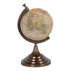 a small globe on a stand with a white background