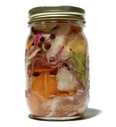 a jar filled with lots of different types of food