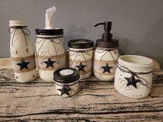 a bathroom set with jars and soap dispensers