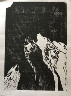 an image of two wolfs facing each other in black and white on a sheet of paper