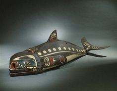 an old wooden carved fish is on display