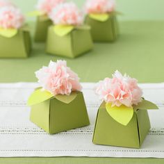 small green boxes with pink flowers on them