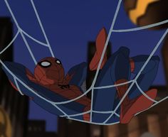 spider - man is hanging upside down in the air