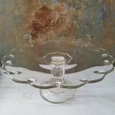 a clear glass bowl sitting on top of a table