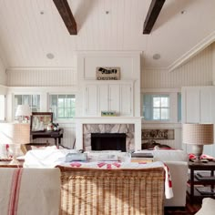 a living room filled with furniture and a fire place