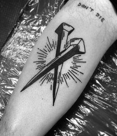 a black and white photo of a tattoo with scissors