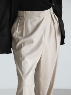 High rise trouser with wide leg and an unbalanced fly at waistband. Creates a stunning silhouette and interesting design. Model is in MINUSEY S. ✔️ Free worldwide express shipping over $100✔️ Loved by 6,500+ customers✔️ Limited edition collections, maximum style⠀⠀⠀⠀⠀⠀⠀⠀⠀Stay ahead of the trend with can’t-find-anywhere-else staples. Your closet will thank you 💕 * MINUSEY S = EU 34, US 2* MINUSEY M = EU 36, US 4* 10% Wool / 60% Polyester / 28% Rayon / 2% Spandex* Dry clean* Made in Korea - Model Height: 172cm/5'7" (US2, EU34) Elegant High Waist Baggy Pants, Elegant Baggy Wide Leg Dress Pants, Elegant Beige Baggy Bottoms, Elegant Baggy Dress Pants, Elegant Baggy Wide-leg Dress Pants, Elegant Baggy Dress Trousers, Modern Beige Ankle-length Pants, Modern Baggy High-waisted Pants, Elegant Baggy Straight Dress Pants