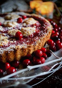 a cake with cranberry toppings on top of it