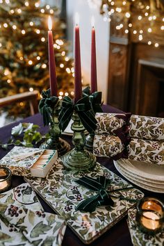 the table is set with candles and place settings