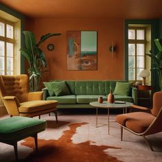 a living room with orange walls and green furniture